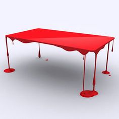 a red table covered in blood and dripping water