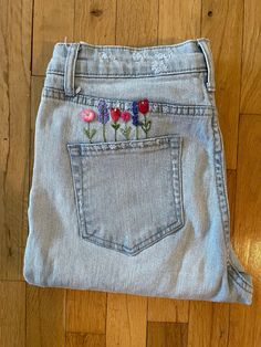 Hand embroidered back left pocket, floral design; pinks, reds and purples. Upcycled jeans from local thrift store.  Good quality, gently worn, Wild Fable size 6 high rise, Mom Jeans light wash. Slight distressed look on front pockets and right leg. All jeans are washed before embroidering. Upcycled Jeans, Stylish Outfits For Women Over 50, All Jeans, Upcycle Jeans, Jeans Light Wash, High Rise Mom Jeans, Womens Jeans, Jeans Light, Back Pocket