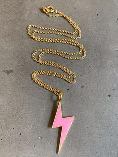 925 sterling vermeil pink enamel bolt charm necklace.Necklace measures 18" in length.Cable style chain with spring ring clasp.18KT gold plate over sterling silver.Bolt charm measures 1/2" W x 1 3/8" L.Follow us on instagram @pennyweightsjewelry! Pink Pendant Charm Necklace, Pink Cable Chain Jewelry Gift, Trendy Pink Sterling Silver Necklaces, Trendy Pink Sterling Silver Necklace, Pink Cable Chain Necklace Gift, Pink Cable Chain Necklace As Gift, Pink Cable Chain Necklace For Gift, Pink Sterling Silver Charm Necklaces, Pink Sterling Silver Charm Necklace With Adjustable Chain