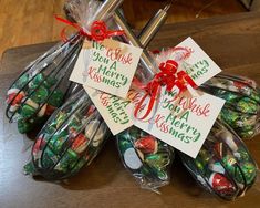 christmas candy wrapped in cellophane and tied with red ribbon, sitting on a table