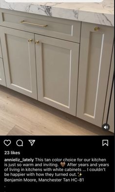 a kitchen with white cabinets and marble counter tops in the middle of it is featured on instagram