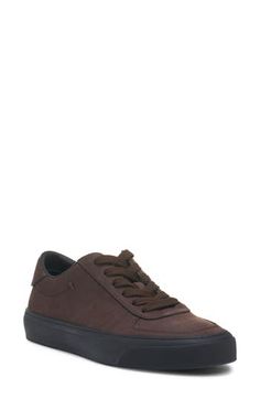 Crafted from coffee-colored nubuck leather, this versatile sneaker serves signature style with a cutout bell logo carving the counter. Lace-up style Leather upper and lining/rubber sole Imported Designer Shoes Brown Suede Plain Toe Sneakers, Bell Logo, Sneaker Men, Coffee Colour, Coffee Bean, Nubuck Leather, Up Styles, Signature Style, Coffee Beans