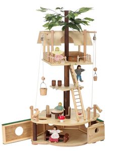 a doll house with furniture and accessories on the top floor, including a treehouse