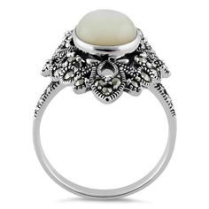 Top of ring height: 27.8mm

Top of ring width: 17.7mm

Band width: 2.8mm

Shank width: 2.8mm



Stone material: mother of pearl

Center stone size: 27.8mm x 17.6mm

Stone shape: oval

Total number of CZ stones: 1

Stone setting: inlay setting



Metal: 925 sterling silver

Finish: high polish Classic Mother Of Pearl Round Rings, Classic Mother Of Pearl Rings, Classic Formal Rings With Mother Of Pearl, Classic Mother Of Pearl Ring For Formal Occasions, Mother Of Pearl Rings For Anniversary, White Mother Of Pearl Wedding Ring, Oval Mother Of Pearl Ring With Polished Finish, Classic White Cabochon Opal Ring, Polished Mother Of Pearl Wedding Rings