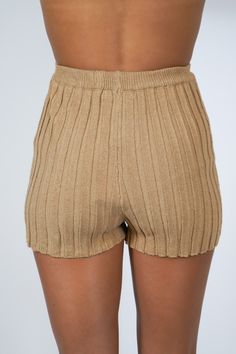 Get ready for summer with our Tiffany Ribbed Shorts! Made with a ribbed design, these pull on shorts are perfect for a comfy and stylish look. Pair them with our matching Tiffany Ribbed Top for a complete outfit. Say goodbye to boring shorts and hello to some serious fashion! Size + Fit Riley is 5'7" and wearing a size Small Content + Care 75% Acrylic 25% Nylon Hand Wash Cold Color Separate Ribbed Bottoms For Beach Summer, Trendy Bottoms With Ribbed Waistband, Ribbed Summer Shorts With Short Legs, Ribbed Summer Shorts, Spring Ribbed Bottoms Short Length, Ribbed Short Bottoms, Stretch Cotton Ribbed Shorts, Trendy Ribbed Shorts, Summer High-waisted Shorts With Ribbed Waistband