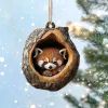 a raccoon in a wooden ornament hanging from a tree