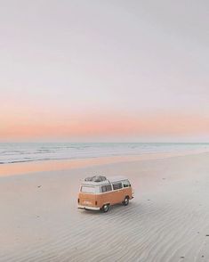 an old vw van is parked on the beach at sunset or dawn with its roof down