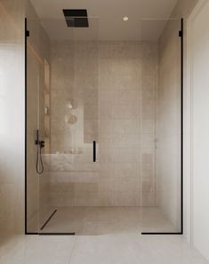 a walk in shower sitting inside of a bathroom