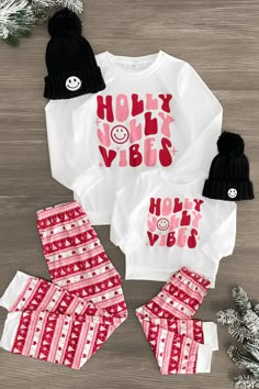 *Adult & child sets sold separately* Pajama set features a white long sleeve top and pair of Nordic print pants Mom & child sets both feature a "Holly Jolly Vibes" design Soft fabric provides cozy all-night comfort Perfect for bedtime or a Christmas movie marathon Gift you and your little ones' wardrobe a seasonally sweet vibe with these "Holly Jolly Vibes" Pajama Sets. These pajama sets come with a long sleeve top and pair of matching bottoms. Both pieces are made from a soft fabric blend for c Mommy And Me Christmas Pajamas, Christmas Movie Marathon, Fabric Outfits, Christmas Matching Pajamas, Family Matching Christmas Pajamas, Cute Christmas Pajamas, Christmas Pajamas Family, Holly Jolly Vibes, Family Christmas Outfits