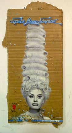 a piece of cardboard with an image of a woman's head in the middle