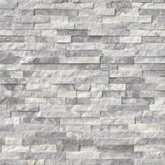 a white brick wall that is made out of grey and white marble bricks, with no mortars or mortars on it