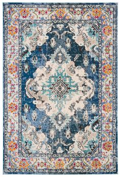 a blue and white rug with an ornate design on the bottom, in different colors