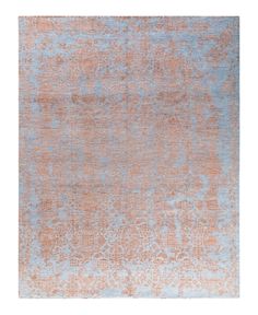 an orange and blue rug on a white background