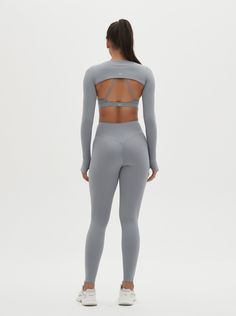 Elevate your activewear wardrobe with the Odette Long-Sleeve Super Crop Top & Sports Bra Set. This unique set combines a stylish super crop top with a supportive sports bra, offering both functionality and fashion. The long sleeves and super crop design provide a chic look, while the sports bra ensures maximum support during your workouts. Perfect for yoga, gym sessions, or casual wear, this set is designed for comfort and performance. Embrace a blend of style and support with the Odette Long-Sl Functional Compressive Sports Crop Top, Compressive Crop Top Sports Bra For Yoga, Compressive Seamless Sportswear Crop Top, Sportswear Long Sleeve Yoga Crop Top, Compressive Seamless Yoga Crop Top, Super Crop Top, Fitness Wardrobe, Supportive Sports Bra, Crop Design