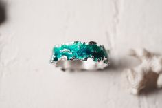 Beautiful ring Wave will bring you back to the sea! This ring is unique! Using hot enamel technique every item receives his own unique texture! https://www.etsy.com/listing/559371911/ - Wide wave ring (10 mm) Details: Width: 5mm Thickness: 1.2 mm Materials: sterling silver 925, hot vitreous enamel These rings in gold: https://www.etsy.com/listing/932462309/ - Gold blue wave https://www.etsy.com/listing/932465221/ - Gold green wave Please provide me size of the ring during the order, thank you! T Unique Green Enamel Ring For Anniversary, Green Enamel Ring For Anniversary, Unique Green Enamel Anniversary Ring, Unique Enamel Wedding Ring, Handmade Enamel Wedding Rings, Green Enamel Ring For Wedding, Unique Enamel Rings For Anniversary, Handmade Enamel Ring For Wedding, Handmade Enamel Anniversary Ring