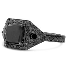 A completely black engagement ring featuring a square cut black diamond center, black accenting diamonds and a solid black rhodium gold setting. Hand engraved filigree and milgrain accent complete this unique ring's antique appearance This is a custom made to order item and can be modified to fit your needs. Please contact us for special customization MAIN GEM Gem: Diamond Shape: Princess Carat Weight: 1.85ctw Color: Black Setting: 4 Prong SIDE STONES Gem: Diamond Shape: Round Carat Weight: 0.80 Engagement Ring Three Stone, Gem Gem, Antique Style Engagement Rings, Black Diamond Engagement Ring, Ring Three Stone, Black Engagement Ring, Black Diamond Engagement, Black Diamond Ring Engagement, Three Stone Engagement Rings