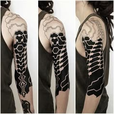 a woman's arm with black and white tattoos on it, including an abstract design