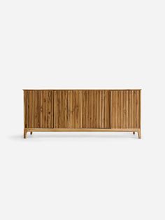 the sideboard is made out of wood and has three doors, two drawers and one door