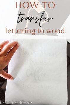 a hand holding a piece of paper with the words how to transfer lettering to wood