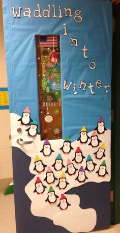 a bulletin board with penguins on it and the words waddling in to winter written below