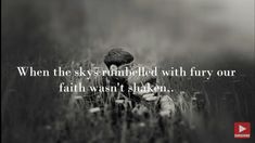 a black and white photo with the words, when the sky's rumbleled with fury our faith doesn't shaken