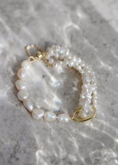 *Enjoy 10% off for a limited time. Use coupon code LIMITED10 at checkout. Does not include bespoke or custom changes. A multi-strand pearl bridal bracelet that hugs your wrist, Kindred is all about timeless elegance and a dash of playful sophistication. Perfect for formal occasions and weddings, Kindred features layers of lustrous pearls that dance together in harmonious beauty. This bracelet adds a touch of classic charm with a modern twist, making it an ideal accessory for brides, bridesmaids, or anyone looking to add a bit of shimmer to their special day. * DETAILS * > Designed and handmade in Australia > Gold plated clasp, freshwater pearls, silk beading thread > Sizes: 6.5 inches (XS), 7 inches (S), 7.5 inches (M), 8 inches (L), 8.5 inches (XL) > Made to order: Production times in tab Elegant Baroque Pearl Beaded Bracelets As Gifts, Timeless White Pearl Bracelet For Anniversary, Timeless Pearl Jubilee Bracelet As A Gift, Akoya Pearl Bracelet With Pearl Drop For Wedding, Gift Pearl Bracelet With Akoya Pearl And Pearl Drop, Timeless White Pearl Bracelet As A Gift, Akoya Pearl Bracelet With Round Beads For Weddings, Elegant Baroque Pearl Beaded Bracelets For Wedding, Timeless White Pearl Bracelet As Gift