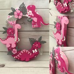 pink and grey dinosaur wooden letters with flowers on the front, one in the middle and one in the back