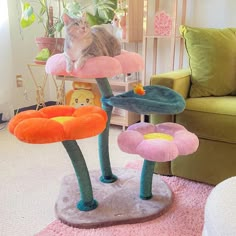 a cat sitting on top of a flower shaped scratching post