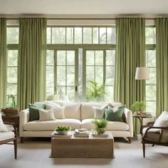 a living room filled with furniture and green drapes on the windows sills