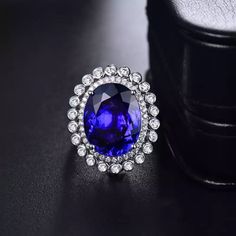 Welcome to Elegant Art Jewelry!  Material: 18k Solid White Gold Stone: Tanzanite Stone Weight: 14.86ct Stone Size: 13mm×17mm Stone Origin: Tanzania Stone Clarity: D Block Gemstone Cut: Oval Cut Side stone: Diamond Weight: 1.10ct Personalization: 9K/14K/24K/GOLD/SILVER/PLATINUM/ROSE-GOLD/WHITE GOLD. (Contact me)  Tanzanite Ring, Tanzanite Cuff Ring, 925 Sterling Silver Ring, Round Shape Ring, Tanzanite Ring, Tanzanite Engagement, Open Design Ring, Tanzanite Oval, Tanzanite Natural, Blue Tanzanite Ring Luxury, Luxury Ring, Oval Cut Ring, Tanzanite Jewelry, Tanzanite Earrings, Platinum Rose Gold, Tanzanite Stone, Cuff Ring, White Gold Engagement Ring