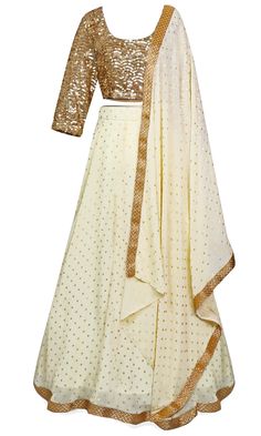 The lehenga skirt is crème in color, and the long-sleeve blouse is completely covered in gold sequins. Long Sleeve Lehenga With Gota Work For Eid, Elegant Cream Lehenga For Navratri, Elegant Long Sleeve Lehenga With Gota Work, Gold Traditional Wear With Gota Work And Long Sleeves, Fitted Cream Sharara With Mirror Work, Long Sleeve Traditional Wear With Sequins For Navratri, Festive Beige Sharara With Gota Work, Festive Cream Lehenga For Reception, Gold Long Sleeve Lehenga With Gota Work