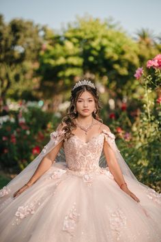 a woman in a wedding dress posing for the camera