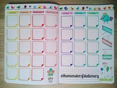 an open planner book with colorful stickers on it