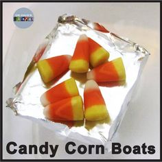 candy corn boats in an ice block with the words candy corn boats on it's side