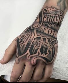 a hand with some writing on it