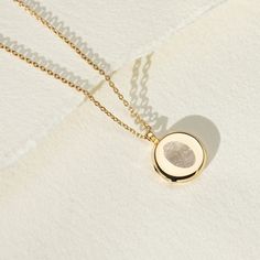 Every locket tells a story and our sterling silver lockets make the most meaningful personalised gift. Capture and enhance the beautiful detail of a fingerprint with our stunning locket necklace. The lines and grooves that make a fingerprint unique are enhanced and lasered onto the front of this stunning locket. Perfect for preserving something special from a child or remembering someone who is no longer with us. The inside can be personalised further and couldn't be simpler, just add text  (i.e. name or date) and one photo, or upload two photos, we'll take care of the rest! A highly polished locket with a hidden hinge ensures the flow of the circle isn't broken. The locket is 16mm flat with softly contoured edges and holds 12mm photos. * * * * * * * * * * * * * * * * * How we'll make your Minimalist Necklace With Engraving Option For Keepsake, Minimalist Keepsake Necklace With Engraving Option, Engraved Round Pendant Locket Necklace As Gift For Her, Minimalist Sterling Silver Locket Necklace, Timeless Round Locket Necklace As Gift, Timeless Engraved Locket Necklace As Gift, Sterling Silver Minimalist Locket Necklace As Gift, Minimalist Engraved Jewelry For Keepsake, Personalized Sterling Silver Locket Necklace As Gift For Her