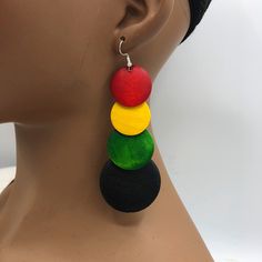 a mannequin head with a pair of earrings on it's earring