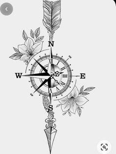 a black and white drawing of a compass with flowers