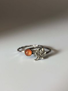 Welcome to Miss November Studio! I specialize in dainty feminine personalized jewelry for the discerning jewelry lover. This listing is for a single sterling silver maple leaf stacking ring. All other rings are sold separately. Make a stack! Add a custom stamped band and two gemstone stacking rings with stones like black onyx and garnet. https://www.etsy.com/listing/150142799/set-of-3-rings-one-personalized-message ********** Stacking rings are excellent accessories, not to mention fun to collect and wear. One ring worn alone is dainty, two is quaint, but a loaded stack is a statement! I love to mix and match my stacking rings. I mix metals and make different stacker themes. Occasionally I wear a single stacking ring with a mantra or a word of encouragement to meditate on. ********** Pleas Minimalist Sterling Silver Leaf Jewelry, Minimalist Leaf-shaped Sterling Silver Jewelry, Hypoallergenic Leaf-shaped Nature-inspired Jewelry, Everyday Nature-inspired Leaf Jewelry, Everyday Sterling Silver Leaf Jewelry, Nature-inspired Stackable Rings For Gifts, Nature-inspired Leaf Jewelry For Everyday, Adjustable Silver Leaf Jewelry, Dainty Amber Sterling Silver Jewelry