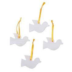 three white doves with yellow ribbons hanging from them