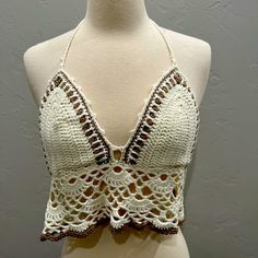 New With Tags Crochet Top In A M/L. Great Condition. White Backless Crop Top With Built-in Bra, Fitted Crop Top With Built-in Bra For Beach, White Halter Top With Built-in Bra For Spring, Fitted Beige Crochet Halter Neck Top, Fitted Triangle Top Crop Top Bra Friendly, Beige Fitted Halter Neck Crochet Top, White Crop Top With Built-in Bra, Fitted Beige Crochet Top For Party, White Halter Neck Crop Top With Built-in Bra