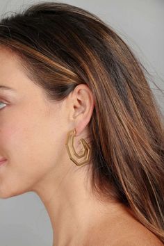 Our Angled Earring is the pair you will reach for again and again. This lightweight trendy hoop earring gets a modern refresh with its six-angled sides and open silhouette. Materials : Gold Plated Brass, Stainless steel Size: 1.5" x 1.5" Post Backing Imported Modern Geometric Hoop Earrings With Ear Wire, Modern Geometric Single Hoop Earring, Modern Geometric Metal Hoop Earrings, Again And Again, Geometric Earrings, Curator Style, Gold Earrings, Hoop Earrings, Brass