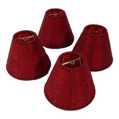 three red lampshades are sitting next to each other