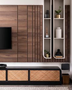 modern living room with wood paneling and built - in shelving unit for entertainment