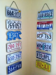 several license plates are hanging on the wall