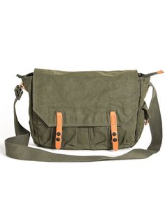 an olive green messenger bag with two brown straps