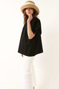 Soft volume and crisp cotton bring a joyful personality to the Cerchi short sleeve shirt. Designed with a loose-fitting simplicity, the Cerchi has a round neck, straight hem, and a rounded, puff sleeve - without being tight at the armhole opening. Wear the Cerchi top with any fitted pant to play with proportions. Made in the same crisp Italian cotton poplin beloved in our shirting with a touch of stretch and never transparent. Size Guide and Fit Designed for a loose fit Easy sizing, fits as expe Relaxed Fit Short Sleeve T-shirt For Daywear, Relaxed Fit Cotton Short Sleeve Work Top, Cotton Relaxed Fit Short Sleeve Top For Work, Relaxed Fit Cotton Short Sleeve Top For Work, Relaxed Black Short Sleeve Top, Oversized Black Cotton Blouse, Casual Oversized Puff Sleeve Tops, Modern Short Sleeve Blouse For Everyday, Oversized Crew Neck Cotton Blouse