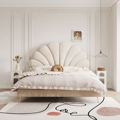 a bedroom with white walls and a large bed that has an intricate shell design on the headboard