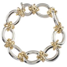 Gorgeous Sterling Silver and 14k Yellow Gold Link Bracelet Features Large Oval Sterling Silver Links connected by 14k Yellow Gold H-Shaped Links Silver Links are Approximately 20 mm Long x 16 mm Wide Made in Italy Total Length = 7.5" Total Mass = 76.6 grams High Jewelry Bracelet, Plain Gold Bangles, Silver Cuff Bangle, Jewelry Chains, Gold Link Bracelet, Charms Bracelet, Gold Link, Elegant Bracelet, Jewelry Lookbook