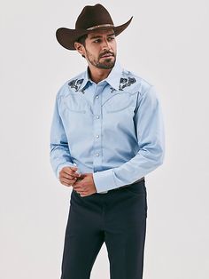 MADE FOR THE TAILORED COWBOY Class up any outfit you're wearing with the Wrangler® Rodeo Ben Western Snap Shirt. Inspired by our early years, this eye-catching take on the cowboy classic is meticulously made down to the smallest detail. It comes with a vintage-inspired pattern, fancy yokes, detailed embroidery, and pearl snaps for a polished look. Dressier than most, this embellished snap shirt for men is crafted from 100% cotton for long-lasting comfort and quality. Western Style Relaxed Fit Shirt For Ranch, Relaxed Fit Cotton Shirt For Rodeo, Fitted Cotton Western Top, Fitted Cotton Shirt For Country Events, Blue Shirt For Rodeo In Spring, Blue Shirt For Spring Rodeo, Western Style Fitted Cotton Tops, Fitted Cotton Top For Rodeo, Blue Button-up Shirt For Ranch